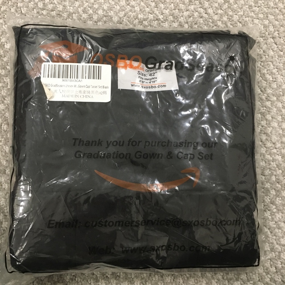 Not used 2020 graduation gown and cap in black